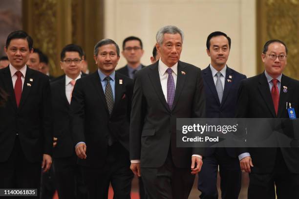 Singapore's Prime Minister, Lee Hsien Loong, third right, arrives at the Great Hall of the People in Beijing for a meeting with China's President Xi...