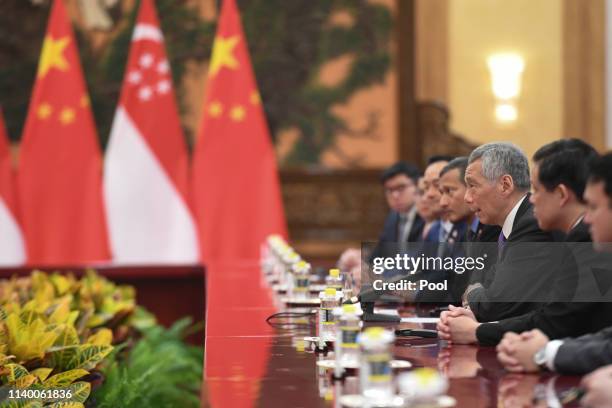 Singapore's Prime Minister Lee Hsien Loong, second right, attends a meeting with China's President Xi Jinping, not pictured, at the Great Hall of the...