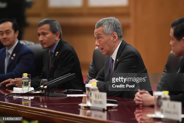 Singapore's Prime Minister Lee Hsien Loong, second right, attends a meeting with China's President Xi Jinping, not pictured, at the Great Hall of the...