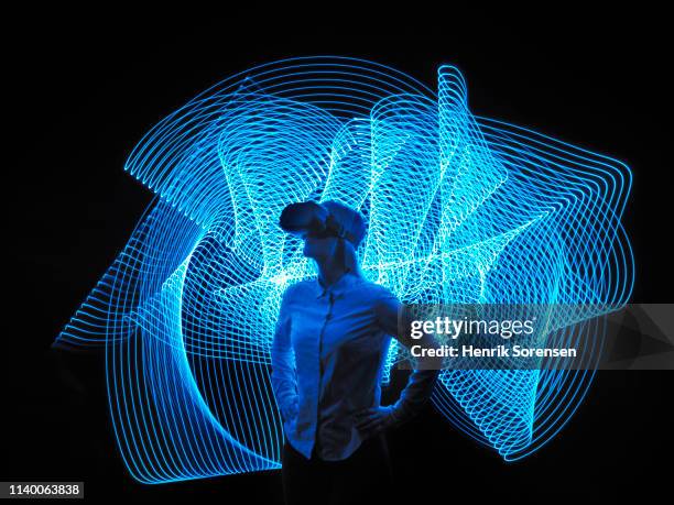 young woman with vr glasses - virtual bildbanksfoton och bilder