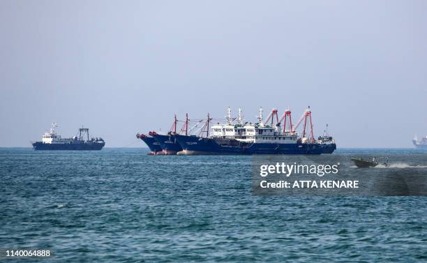 Fishing ships are pictured in the Gulf off the Iranian port city of Bandar Abbas, which is the main base of the Islamic republic's navy and has a...