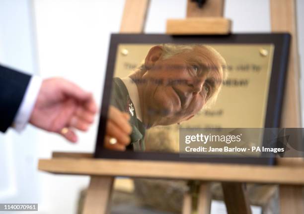 The Prince of Wales, known as the Duke of Rothesay while in Scotland, unveils a plaque during a visit to the Banff Museum in Banff, Aberdeenshire.