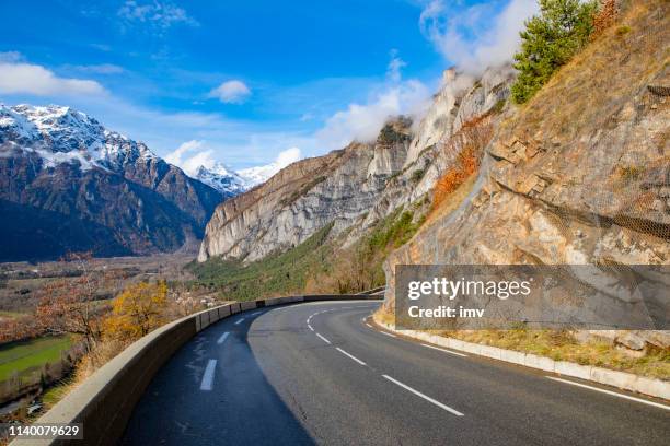 alpe-d'huez road in winter - alpe d'huez stock pictures, royalty-free photos & images