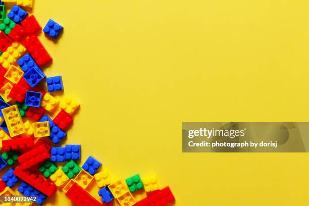 directly above shot of colorful toy blocks - bloque de madera fotografías e imágenes de stock