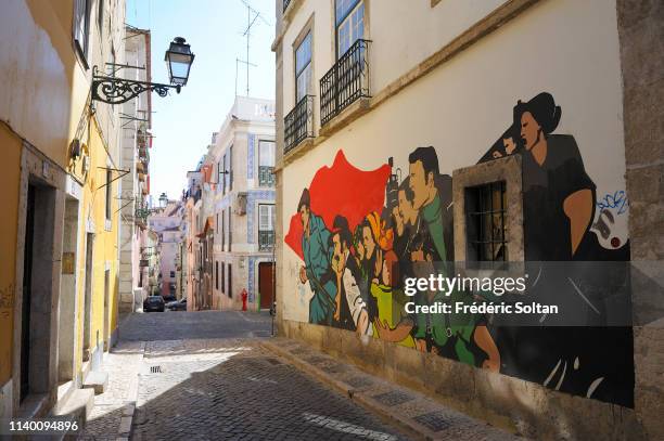 Mural painting and graffitis relating the Carnation Revolution of 1974 in August 20, 2014 in Lisbon, Portugal.