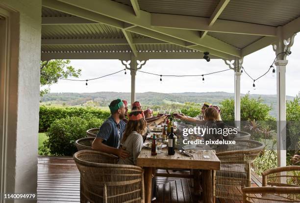 coming together with good food and wine - family porch stock pictures, royalty-free photos & images