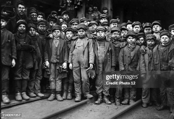 Breaker boys working in Ewen Breaker Coal Mine, South Pittston, Pennsylvania, USA 1910. A breaker boy was a coal-mining worker in the United States...