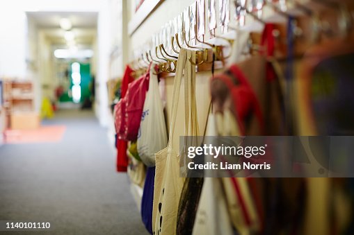 School bags hanging on row of coat hooks in elementary school School bags hanging on row of coat hooks in elementary school