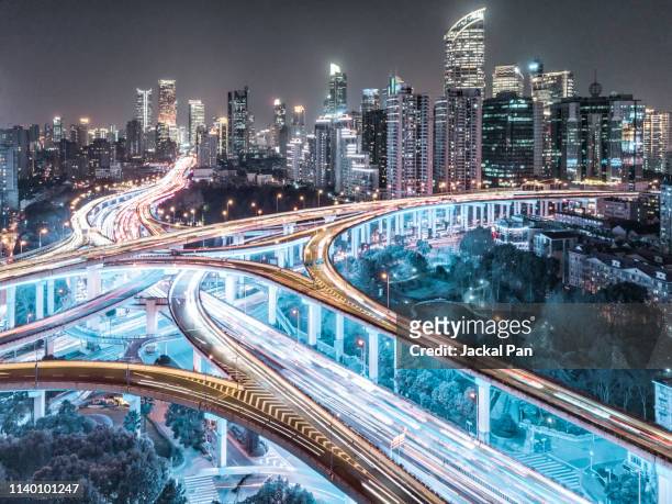 aerial view of shanghai highway at night - digital highway stock pictures, royalty-free photos & images