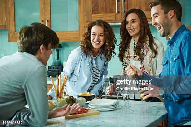 friends celebrating at home - party food and drink stock pictures, royalty-free photos & images