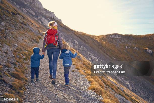 mother and sons, hiking along mountain path, karwendel-mittenwald, bavaria, germany - mittenwald stock pictures, royalty-free photos & images