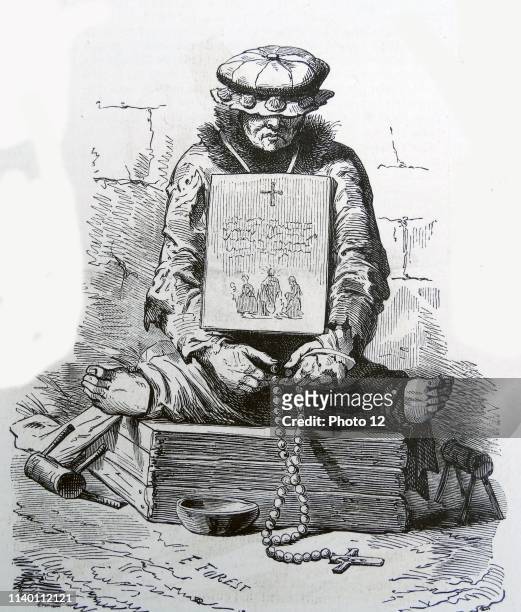 Illustration of a French medieval leper. On either side of him are hand crutches which would be used to propel the leper forward. He is also sat with...