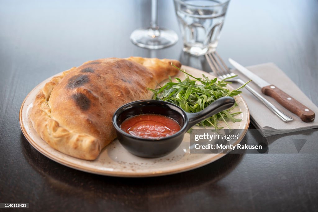 Calzone Dish At Italian Restaurant High-Res Stock Photo - Getty Images