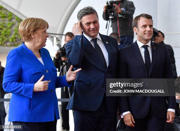 German Chancellor Angela Merkel and French President Emmanuel Macron greet Chairman of the Council of Ministers of Bosnia and Herzegovina Denis...