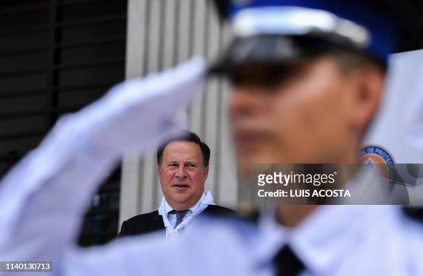 Panamanian President Juan Carlos Varela looks on during a ceremony in which the Electoral Court takes command of the security forces ahead of the...