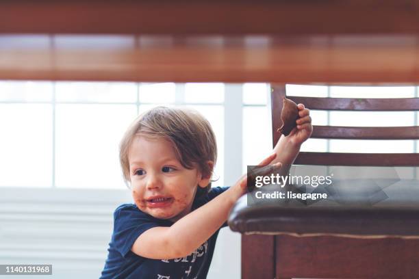 sister and brother eating chocolate - dirty easter stock pictures, royalty-free photos & images