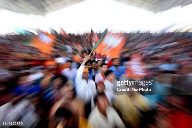 Indian supporters of the Bharatiya Janata Party shout slogans at the PM Modi campaign rally ahead of the national elections in Chanditala on April...