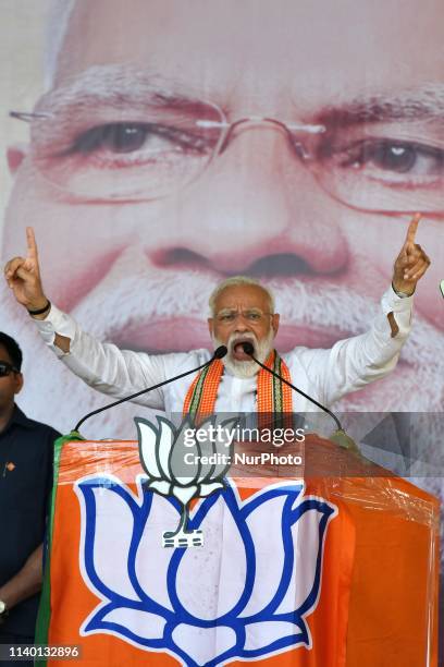 Prime Minister Narendra Modi gestures while addressing his supporters during an election campaign rally ahead of the national elections in...