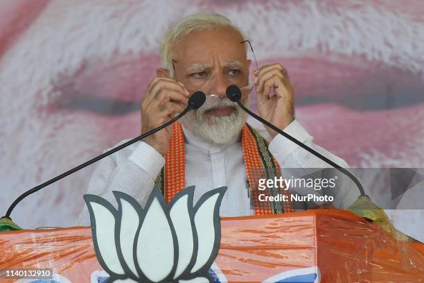 Prime Minister Narendra Modi gestures while addressing his supporters during an election campaign rally ahead of the national elections in...