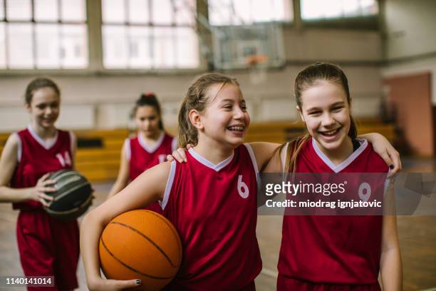 friendship on basketball court - basketball sport team stock pictures, royalty-free photos & images