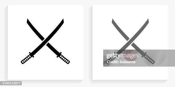 katana swords black and white square icon - samurai sword stock illustrations