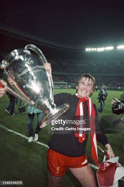 Liverpool player Kenny Dalglish parades the European Cup wearing a wool sweater after the 1981 European Cup Final victory over Real Madrid at Parc...