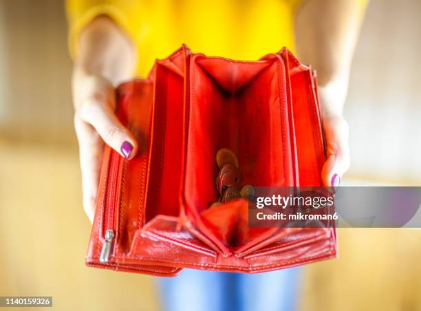 woman hand holding empty wallet - wallet stock-fotos und bilder