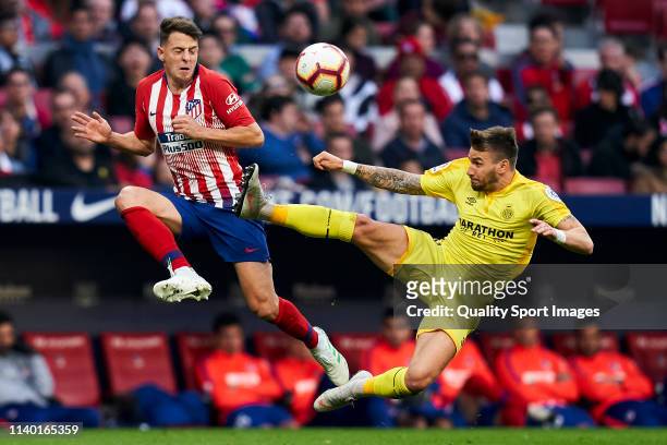 Santiago Arias of Atletico de Madrid battle for the ball with Cristian Portugues of Girona during the La Liga match between Club Atletico de Madrid...