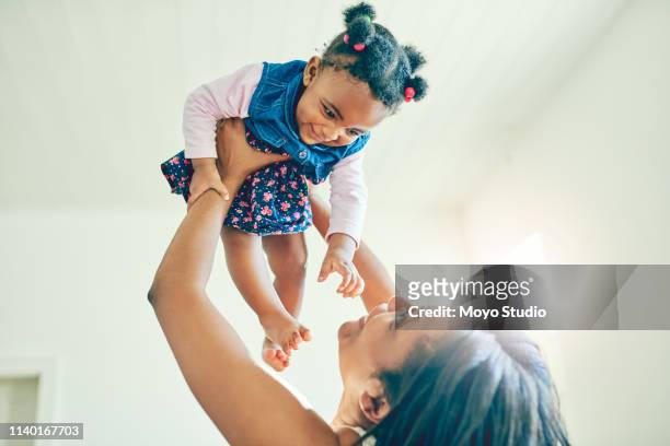 i will always put you on top of the world - picking up kids stock pictures, royalty-free photos & images