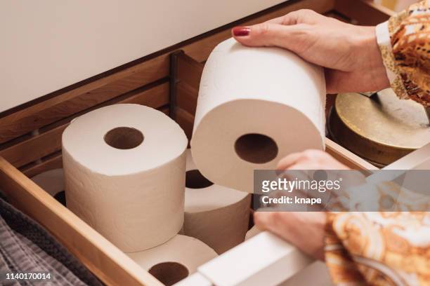 toilet paper storage in bathroom drawer - toilet paper stock pictures, royalty-free photos & images