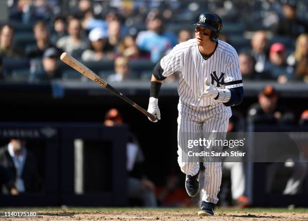 Troy Tulowitzki of the New York Yankees runs to first during the sixth inning of the game against the Baltimore Orioles at Yankee Stadium on March...