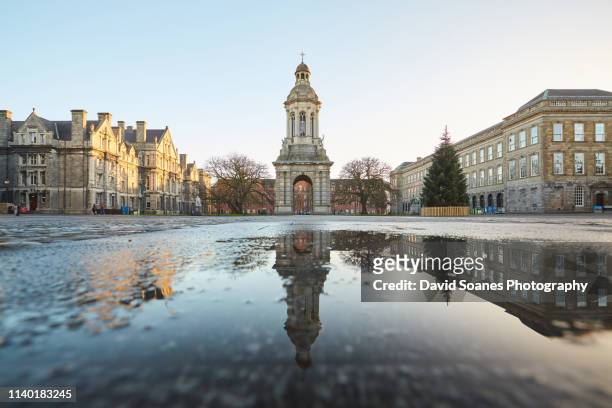 a reflection of the campanile in trinity college, dublin city, ireland - trinity college dublin stock pictures, royalty-free photos & images