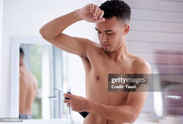 the scent of success - under the arm stock pictures, royalty-free photos & images