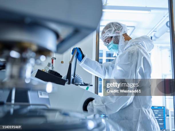 chemist working in industrial laboratory - man wearing protective face mask stock pictures, royalty-free photos & images