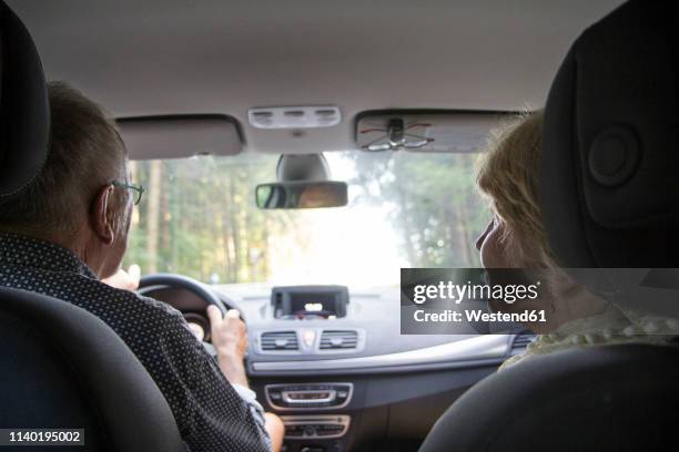 senior couple in the car - altes auto stock-fotos und bilder