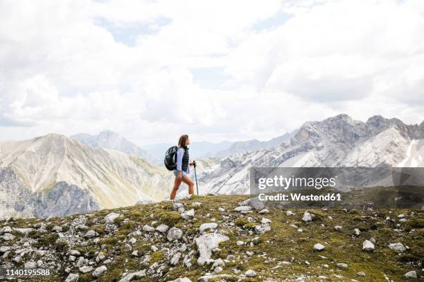 austria, tyrol, woman on a hiking trip in the mountains - austria summer stock pictures, royalty-free photos & images