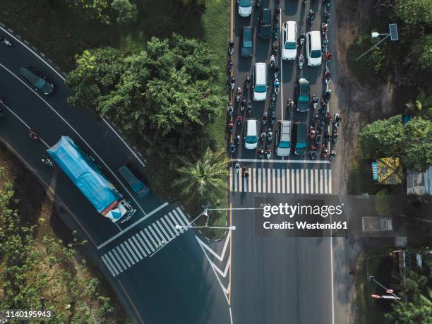 indonesia, bali, sanur, aerial view of cars, motorbikes and a truck on the road - indonesia bikes traffic stock pictures, royalty-free photos & images