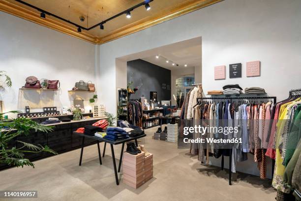 interior of a modern concept store, displaying fashion - tienda de ropa fotografías e imágenes de stock