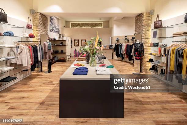 interior of a modern concept store, displaying fashion - bekleidungsgeschäft stock-fotos und bilder