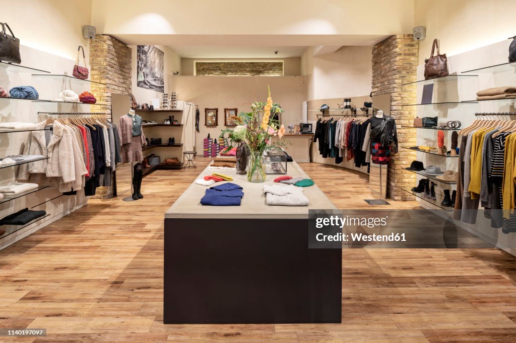 Interior of a modern concept store, displaying fashion