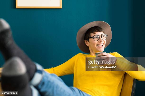 portrait of happy relaxed businesswoman in home office - leisure work coffee happy stockfoto's en -beelden