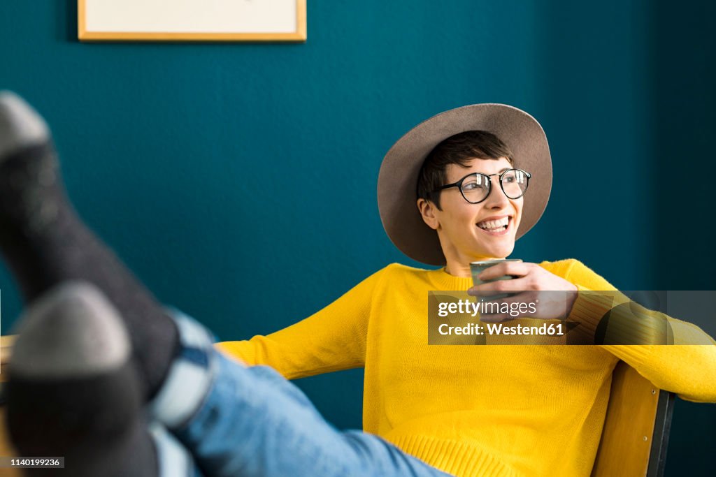 Portrait of happy relaxed businesswoman in home office