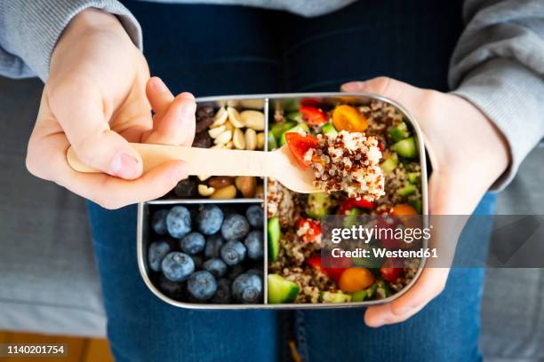 lunchbox with quinoa salad with tomato and cucumber, blue berry and trail mix - packed lunch stock pictures, royalty-free photos & images