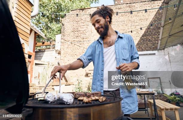 Man Using Grill Man Grill Smile Photos and Premium High Res Pictures - Getty Images