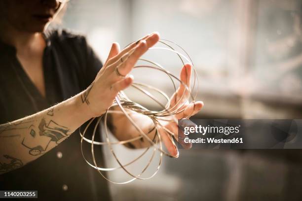 designer playing with ring forms - jewellery designer stock pictures, royalty-free photos & images