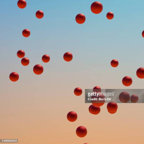red golf balls flying - large group of objects sport stock pictures, royalty-free photos & images
