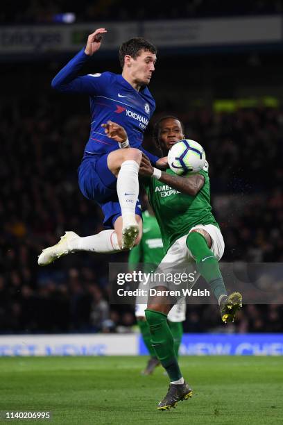 Andreas Christiansen of Chelsea is challenged by Gaetan Bong of Brighton and Hove Albion during the Premier League match between Chelsea FC and...