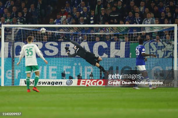 Milot Rashica scores his team's first goal past goalkeeper Alexander Nuebel of Schalke during the DFB Cup quarterfinal match between FC Schalke 04...