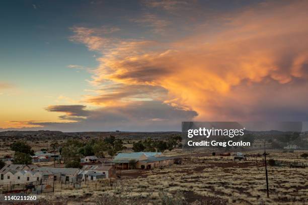 storm over australian outback ghost town at sunset - decades stock pictures, royalty-free photos & images