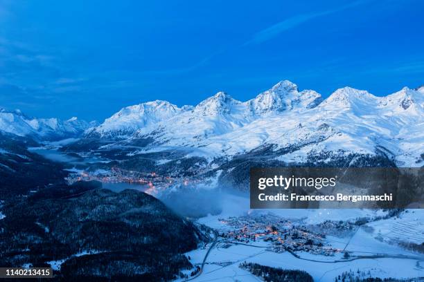 elevated view of high engadine at dusk. engadine valley, canton of grisons, switzerland, europe. - saint moritz stock-fotos und bilder